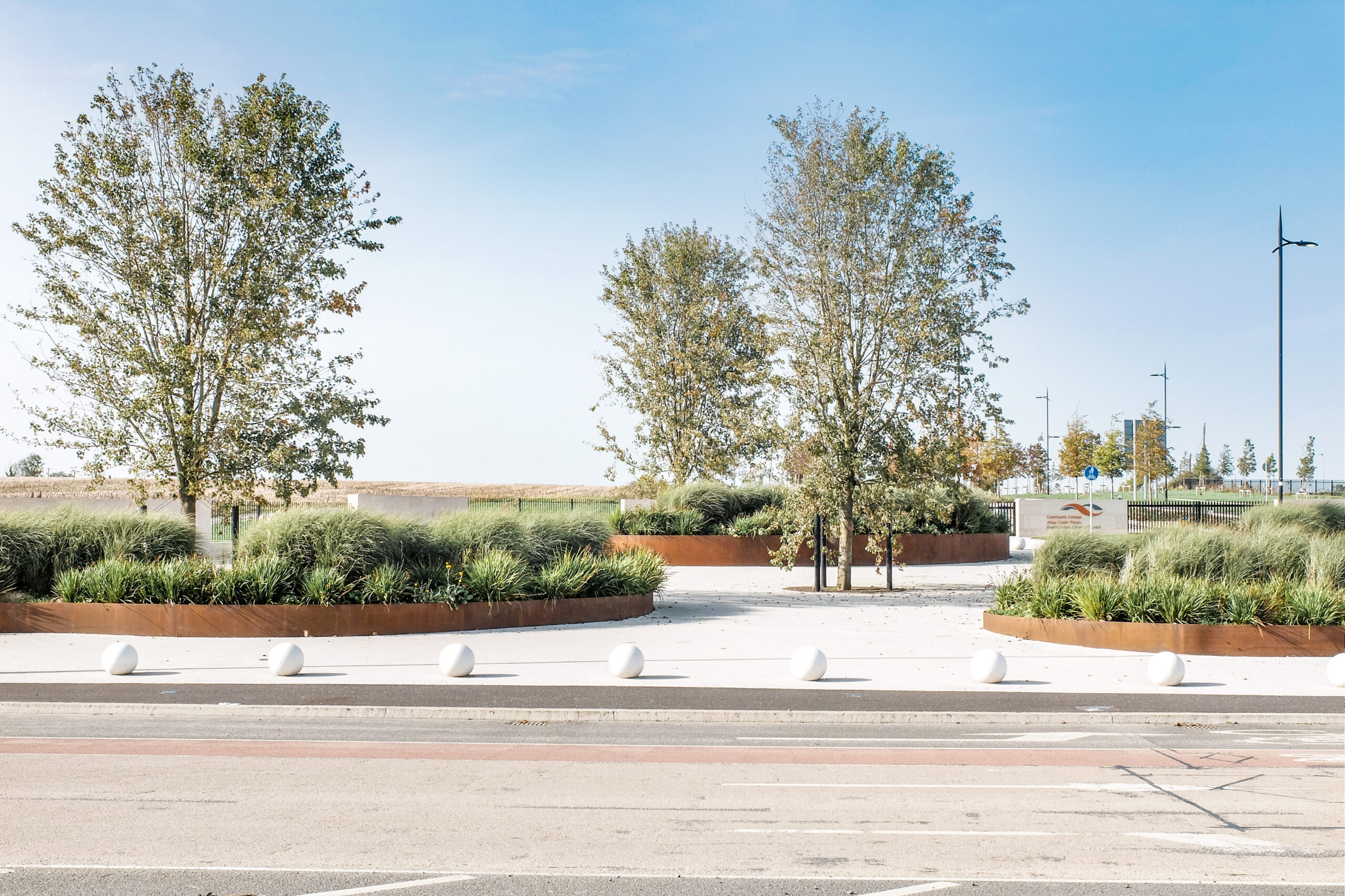 Corten steel planters, paving selection and planting design